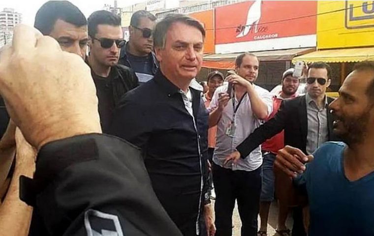 “Brazil cannot stop or we'll turn into Venezuela,” Bolsonaro later told reporters outside his official residence.