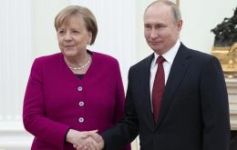 Vladimir Putin and Angela Merkel prior to a meeting in the Kremlin in Moscow on January. AP