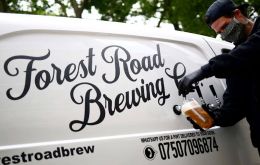 Driving a white van with the slogan “tactical beer response unit” on the side, Peter Brown, director of Forest Road Brewing Co., fulfills delivery orders. 