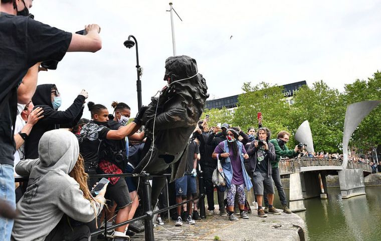 Demonstrators in Bristol pulled down the statue to Edward Colston on Sunday and threw it into the water (Pic AP)