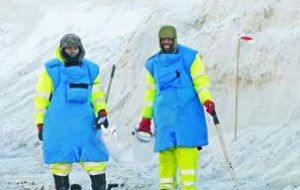 Safelane Deminers Thomas Hlaisi and Admire Mambohaatum wait to examine anything  suspicious