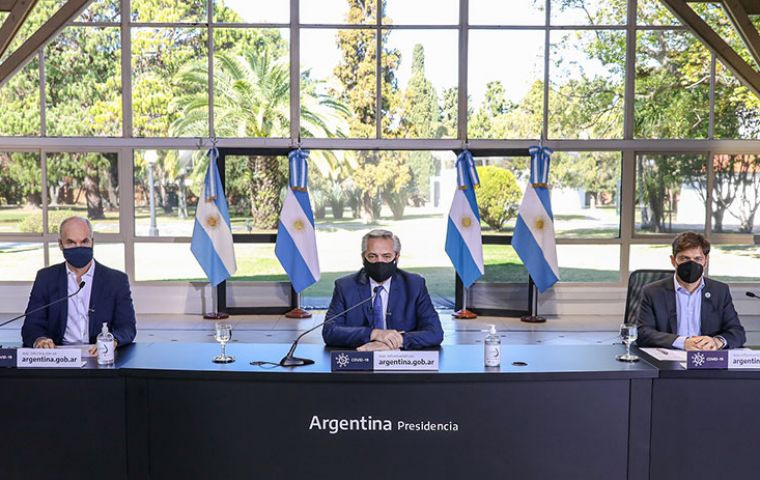 President Alberto Fernandez next to governor Axel Kicillof and Buenos Aires City mayor Horacio Rodriguez Larreta  (L) during the announcement on Friday 