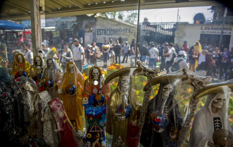 The Grim Reaper-like figure, whose devotees include drug cartel members as well as ordinary Mexicans, has been rejected by the Catholic Church as blasphemous.