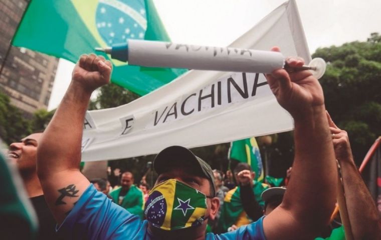 The protestors in São Paulo rallied in support of Bolsonaro, with one demonstrator holding a sign saying “We are not guinea pigs” 