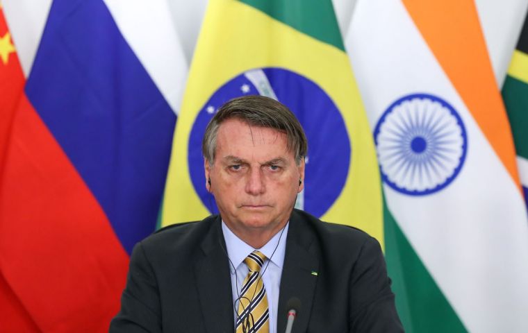Addressing a BRICS summit, Bolsonaro said Brazilian police had developed a way of tracking wood exported from the Amazon using isotopes.