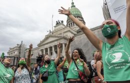 Supporters of the legislation, dressed in distinctive green scarves, cheered and hugged each other in the streets of Buenos Aires after the vote for the bill