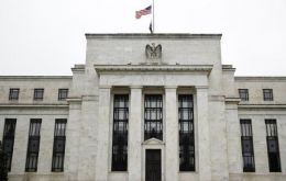 The Fed held its benchmark interest rates at near zero, and opted to purchase at least US$120 billion in bonds each month