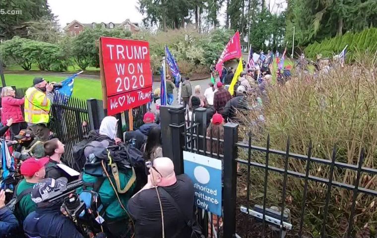 Hundreds of Trump supporters broke through the gates of the Washington governor's mansion complex in Olympia late Wednesday, flooding the lawn