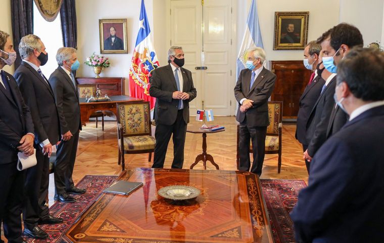 Sebastián Piñera and Alberto Fernandez with their cabinet members in the presidential palace, Casa de la Moneda, Santiago de Chile 