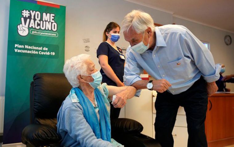 As the first doses were applied at a vaccination center in Futrono, Piñera described the campaign as a “tremendous challenge.”