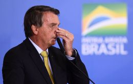 “If I start talking a lot, the hiccup crisis returns,” Bolsonaro told his supportees Tuesday.