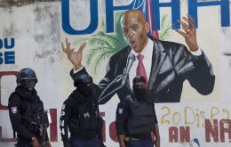 Haiti has lots of gangsters and hit men of its own, and two dozen white foreigners would stick out a bit.