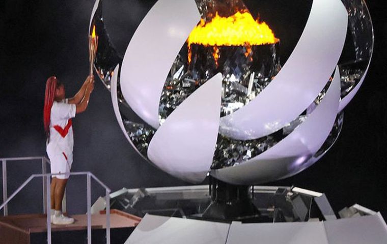 Japanese tennis player Naomi Osaka lit the Olympic cauldron