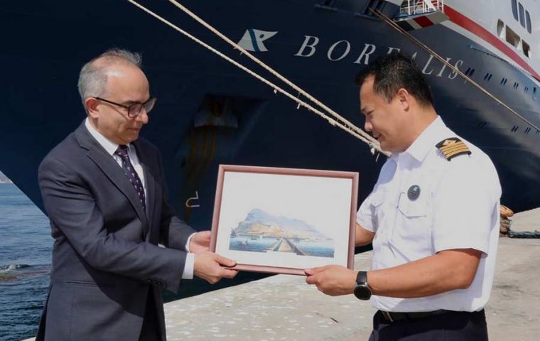 Minister Daryanani and Captain Rommel Pineda engaged in the traditional exchange of plaques at the Gibraltar cruise terminal. 