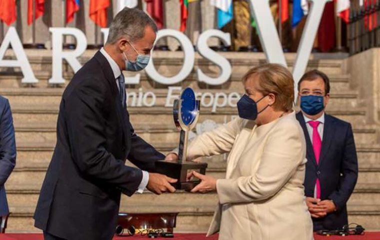 The Carlos V European award was presented to the caretaker Chancellor by King Felipe VI in a ceremony held in Spain. (Pic AFP)