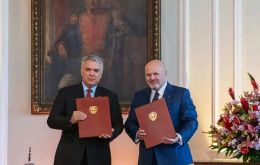 Iván Duque Márquez, President of Colombia and Karim A.A. Khan QC, ICC Prosecutor with copies of the Cooperation Agreement 
