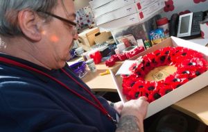 A veteran makes a Scottish poppy wreath at Lady Haig's Poppy Factory (Picture: Poppyscotland).