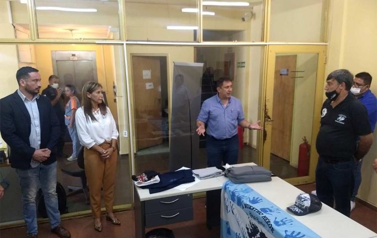 Norma Raquel Sawicz with a Malvinas T shirt and on the desk the controversial one she wore when taking the oath of office