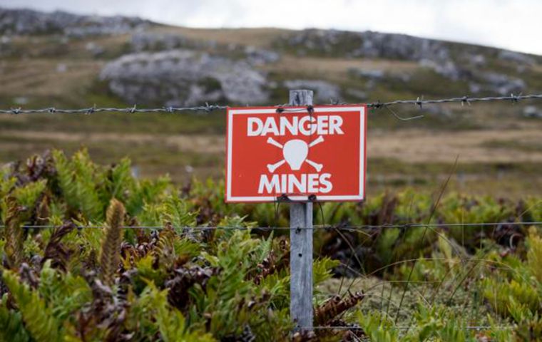 The fences with their danger warnings being removed from the once mined fields after almost four decades 