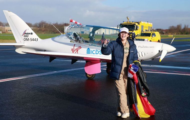 After waving to the jubilant crowds, Rutherford draped herself both in the Union Jack and Belgian tricolor flags.