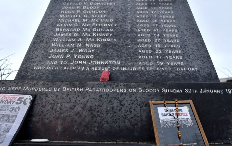 The march concentrated at the Bloody Sunday monument, where the killings occurred, with children carrying white roses and portraits of the victims.  