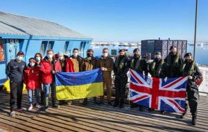 HMS Protector, lead by Captain Michael Wood, alongside Base Commander Bogdan Gavrylyuk and some of the Vernadsky base staff (Pic MoD)