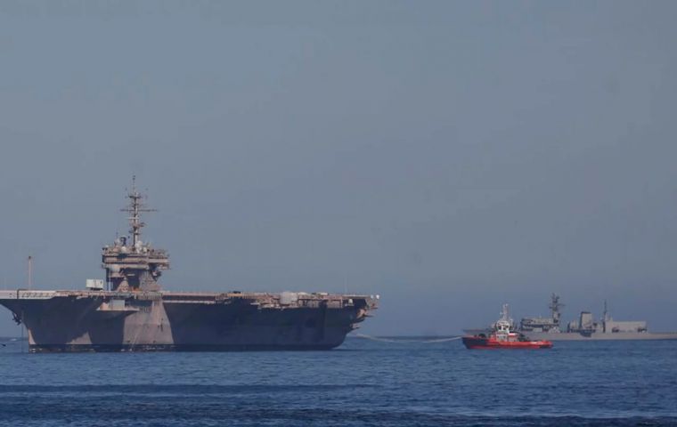 The aircraft carrier USS Kitty Hawk crossed to the Atlantic after a brief call at Punta Arenas 