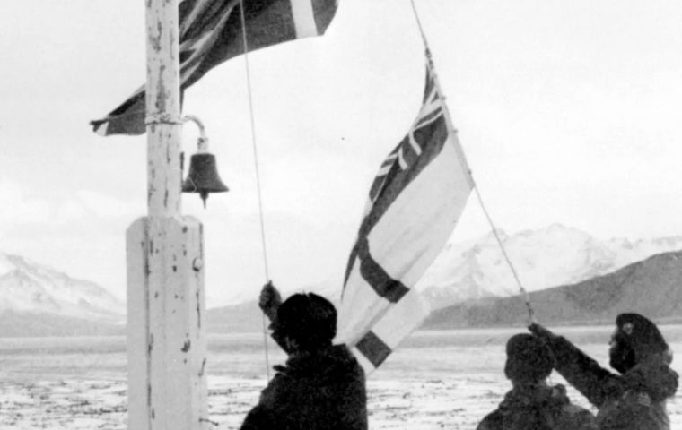 The image on the souvenir sheet features RN Officers raising the white ensign alongside a union jack in the days following the Liberation of South Georgia.