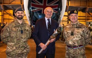 Falklands' National Sports Council chair, Mike Summers with the Baton and BFSAI Commander Jonathan Lett (Pic BFSAI)