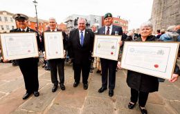Falklands Veterans with the document granting the Freedom of the City, next to MLA Roger Spink