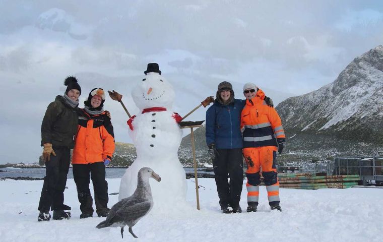 This year’s Bird Island wintering team celebrating Midwinter Day with games in the snow. (Photo: Imogen Lloyd.)