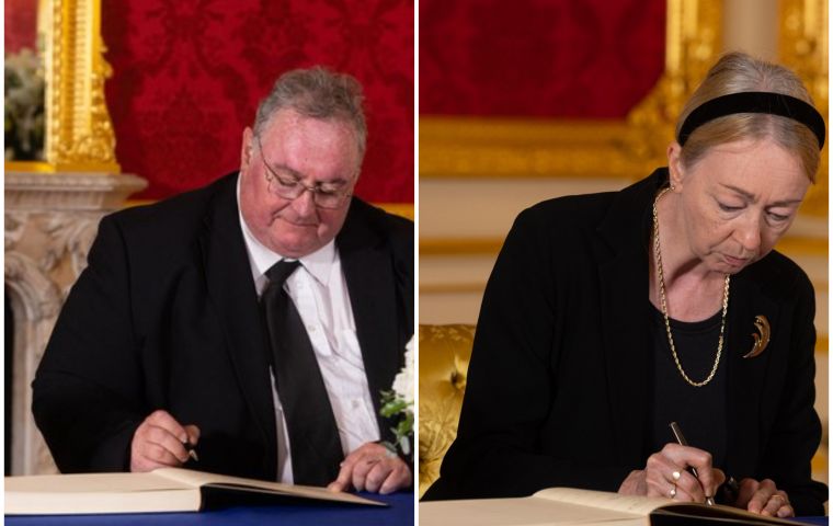 MLA Roger Spink and Governor Alison Blake sign the Official Book of Condolence at Lancaster House