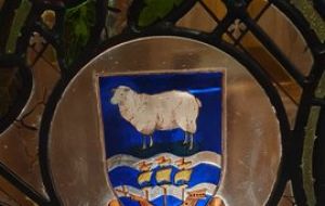 The Falklands crest, “Desire the Right” at the stained glass window