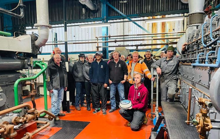 Photographed on celebration day is the Power Station Staff with their cake made by Michele Evans.