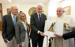 “Thank you very much for visiting me,” Francis said to Clinton in English