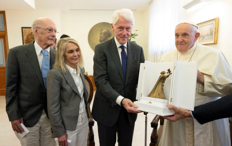 “Thank you very much for visiting me,” Francis said to Clinton in English