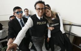 Zurita and González Náder wear police bulletproof vests