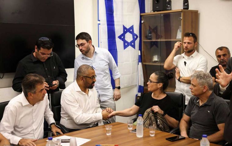 The Foreign Secretary meeting survivors in the southern Israeli village of Ofakim.