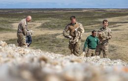 Soldiers helping to spread wool in the erodes soil (Pic BFSAI)