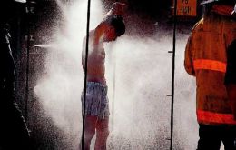 A crew member takes de-intoxication shower