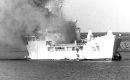 RFA Sir Galahad ablaze after the bombing raid by the Argentine air force, 8 June, only a week before the surrender of the occupying Argentine forces  