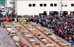 Mourners gather for Good Friday's open-air ceremony in L'Aquila