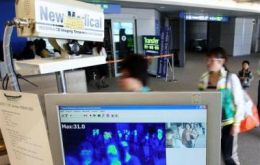 A thermal camera monitors the body temperature of passengers arriving from overseas against the possible infection of the swine flu