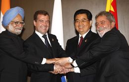 The four leaders shake hands